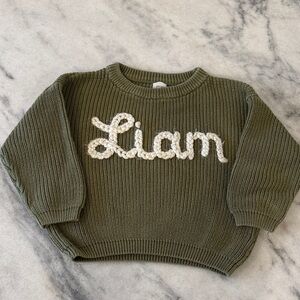 Green Knit Sweater with White Text